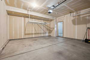 Garage featuring a garage door opener