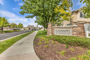 Community sign featuring a residential view