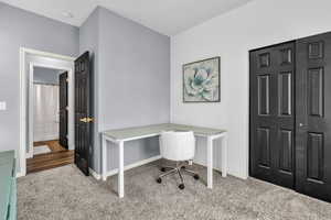 Carpeted office featuring baseboards