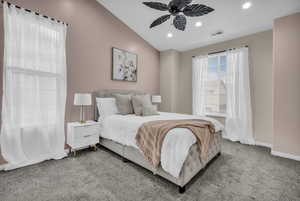 Carpeted bedroom featuring recessed lighting, lofted ceiling, and ceiling fan