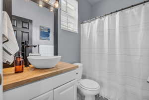 Bathroom featuring vanity and a shower with shower curtain