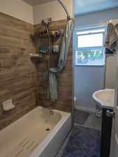 Full bath with shower / bathtub combination with curtain, vanity, and tile patterned flooring