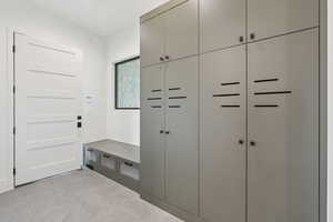 Mudroom featuring light tile patterned floors