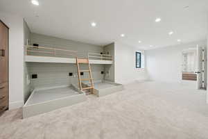 Unfurnished bedroom with recessed lighting and light colored carpet
