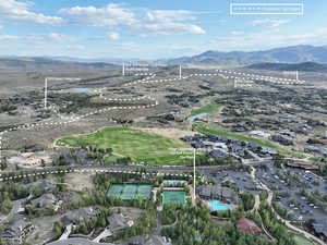 Aerial view of property's location featuring mountains and a pool