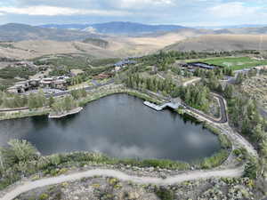 View of property location featuring a water and mountain view