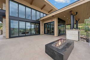 View of patio featuring a fire pit
