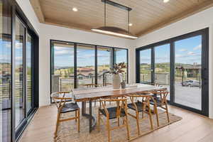 Dining space featuring wooden ceiling, light wood-style floors, and recessed lighting