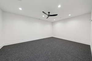 Empty room with recessed lighting and ceiling fan