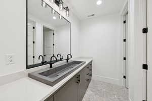 Bathroom featuring vanity and recessed lighting