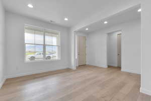 Spare room with recessed lighting and light wood-style flooring