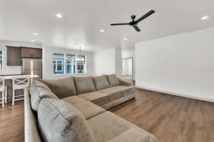 Living room featuring recessed lighting, wood finished floors, and a ceiling fan