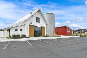 View of property with uncovered parking