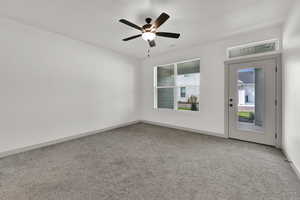 Unfurnished room with light carpet and a ceiling fan