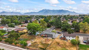 Aerial perspective of suburban area with a mountainous background