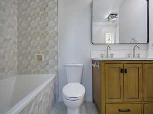 Bathroom with double vanity and light tile patterned floors