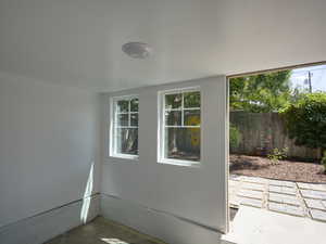 Entryway featuring unfinished concrete flooring