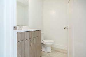 Bathroom featuring vanity and light wood-style flooring