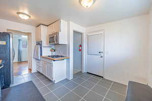 Kitchen. Stainless Steel Appliances! Gas Range. Wall Oven. Beautiful Tile!