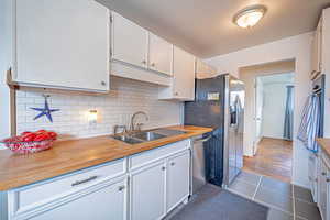 Kitchen. Stainless Steel Appliances! Gas Range. Wall Oven. Beautiful Tile! Gorgeous White BackSplash!