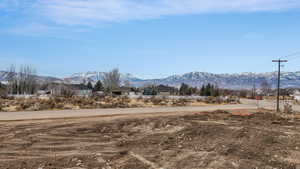 View of asphalt road with a mountain view and a rural view
