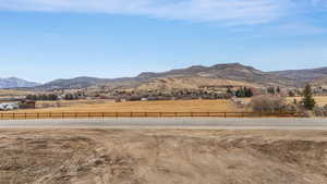 View of mountain backdrop with rural landscape