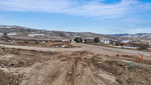 View of dirt / gravel road with a mountain view