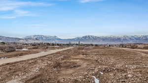 View of mountain backdrop featuring rural landscape