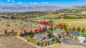 Aerial perspective of suburban area with a mountainous background