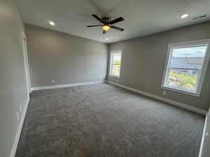 Spare room with light colored carpet, recessed lighting, and ceiling fan