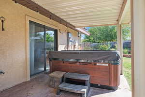 View of patio / terrace with a hot tub