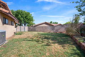 View of fenced backyard