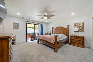 Carpeted bedroom featuring access to exterior, ceiling fan, recessed lighting, and a textured ceiling