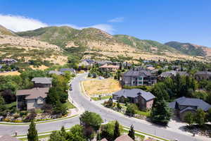 Aerial view of residential area featuring a mountainous background