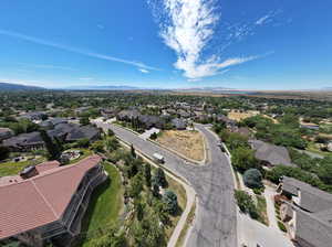 Aerial perspective of suburban area featuring a mountainous background