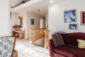 Living room with carpet floors and recessed lighting