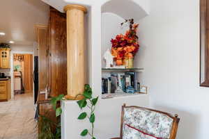 Detailed view of recessed lighting and black fridge