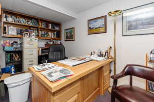 Home office featuring a paneled ceiling