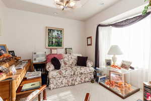 Living area featuring carpet and recessed lighting