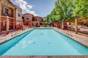 Community pool with a patio area