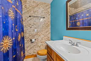 Full bathroom featuring vanity and a shower with shower curtain
