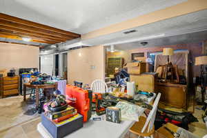 Finished below grade area with a textured ceiling