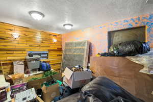 Misc room featuring a textured ceiling