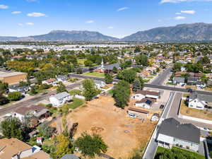 Aerial perspective of suburban area with a mountainous background