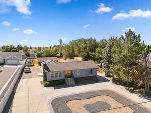 View of front of house featuring curved driveway and a residential view