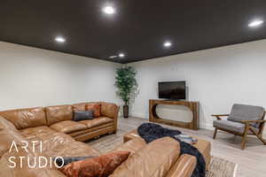 Living area featuring recessed lighting and light wood finished floors