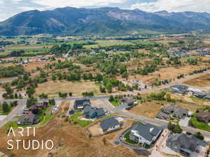 Aerial view of residential area featuring a mountain backdrop