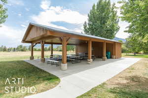 View of property's community featuring a patio and a yard