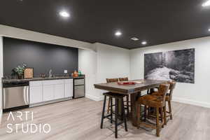 Dining space featuring light wood-style flooring and recessed lighting