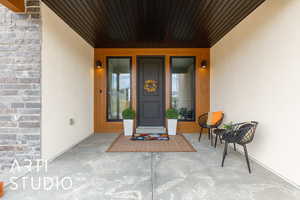Property entrance with stucco siding
